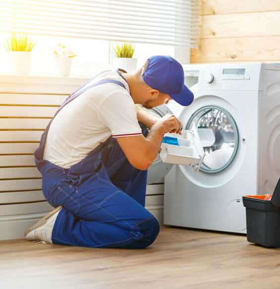 Technician repairing a laundry connection