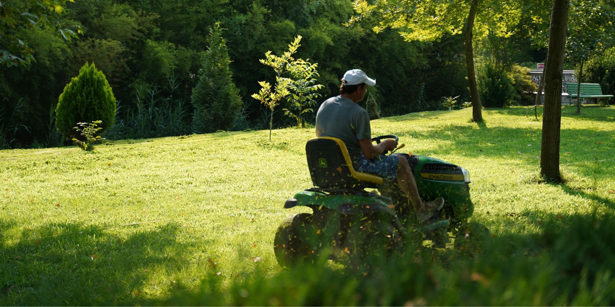 Riding mower on a large lawn