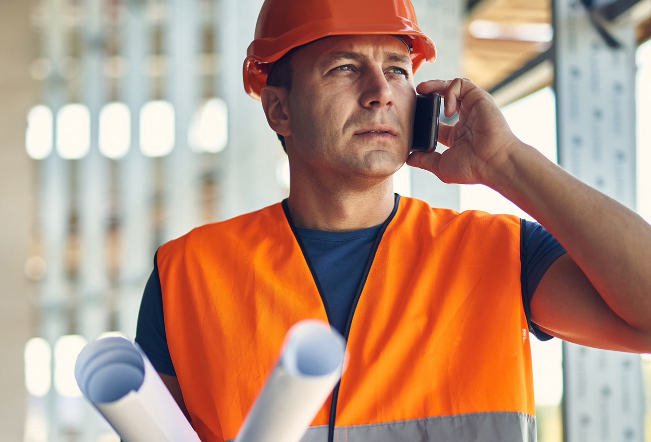 Contractor discussing plans with homeowners