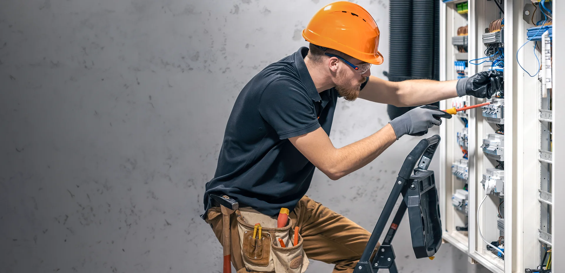 AmpRight electrician servicing a breaker panel