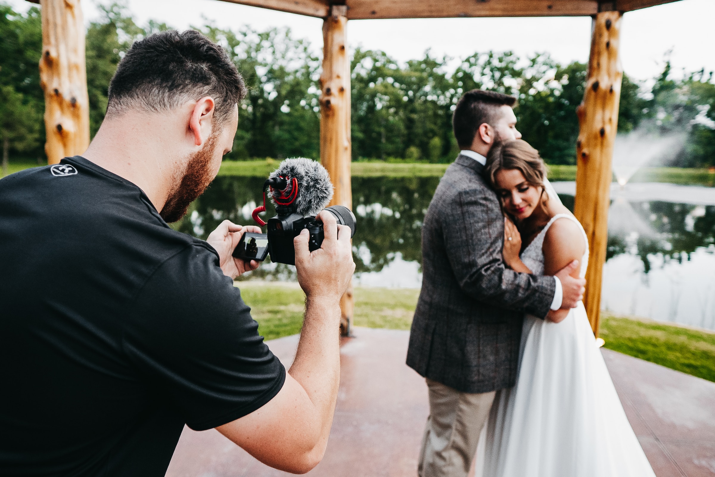 Photographer capturing a couple during their portrait session